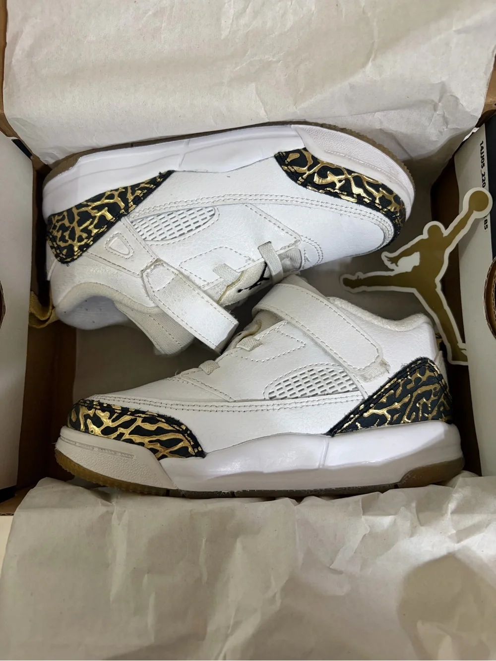 Jordan Kids White Sneakers with Black and Gold Accents